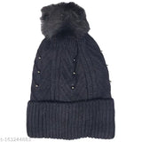 Black wool beanie hat with soft pom pom, warm for winter weather