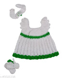Green and white hand-knitted crochet baby frock with colorblock design, sleeveless and made from wool