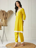 Women's Yellow PolyCotton Kurta & Pant Co-ord Set, featuring 3/4 sleeves with delicate lace detailing and easy-wear style in sizes S to XXL. Perfect for everyday wear or relaxed outings, pairs well with sneakers or sandals. V-neck top design adds elegance to casual silhouette. Origin: India