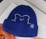 Assorted color Korean-style acrylic beanies with embroidered bear designs. Soft, non-shrinking, and lightweight for women & men. Embroidered smile face design adds joy." (124 characters)