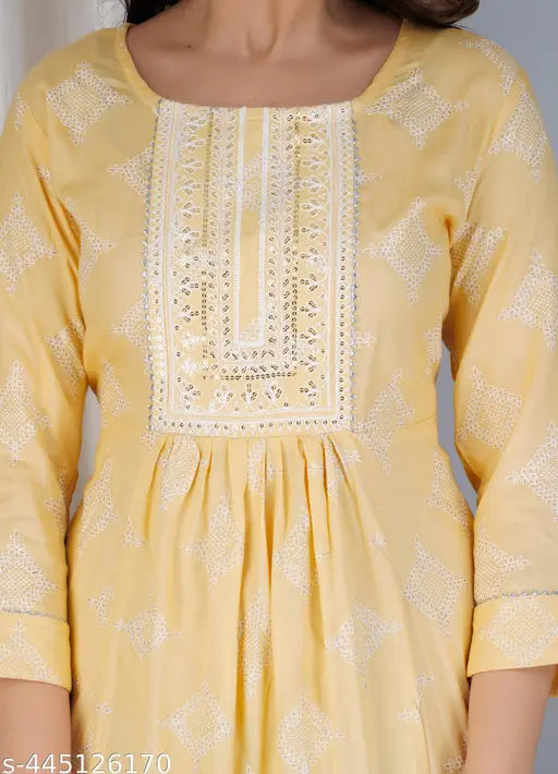Viscose rayon printed anarkali Gawon in cream and gold, three-quarter sleeve women's kurta on display rack