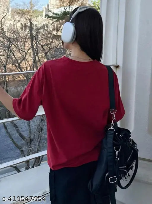 Maroon cotton-blend oversized t-shirt with printed design, ideal for casual or occasion wear, great for layering and providing a stylish look