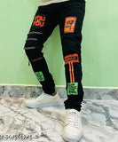Men's black cotton blend jeans, fashionable with slim fit, unique design, and 3 chains on right side leg. Available in sizes 24, 26, 28, 30 (Waist Size 24in-30in, Length Size 39in). Indian origin