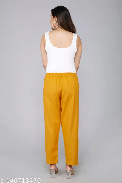 Gold cotton casual trousers, regular fit, pleats detailing, ankle length, side pockets, elasticated back, versatile for daily wear or travel