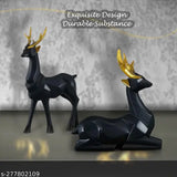 Black resin deer statues set (2 pieces), Indian artisan crafted, vibrant home/office decor. Ideal for gifting or display on shelves, 14cm x 6cm x 23cm each. Hand-wash with dry cloth. Symbolizes harmony and love in Feng Shui