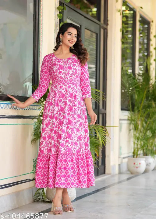 Pink rayon printed combo kurtis with embroidered yoke, tassels, and three-quarter sleeves. Sizes: S (36in bust), M (38in bust), L (40in bust), XL (42in bust), XXL (44in bust), XXXL (46in bust). Indian ethnic fashion for vibrant women's wear