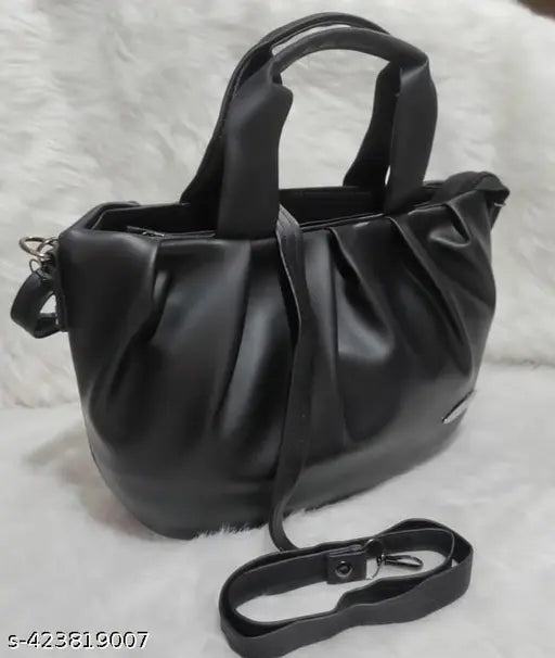 Black faux leather chunnat pattern sling bag for women and girls with adjustable strap, featuring 2 compartments. Handcrafted in India