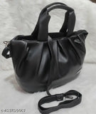 Black faux leather chunnat pattern sling bag for women and girls with adjustable strap, featuring 2 compartments. Handcrafted in India