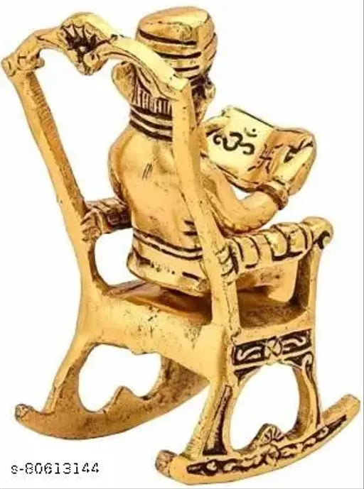 Gold Ganesha idol on chair, reading Ramayana, aluminum oxide material, Indian handcrafted decor showpiece