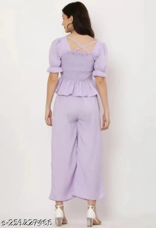 Purple crepe jumpsuit by RITIKA ENTERPRISES, perfect for parties or office wear. Features trendy pleated black plazzo with short sleeves." (92 characters)