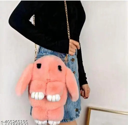 Soft pink fabric plush bunny sling bag with chain and smooth zipper, featuring a realistic rabbit design. Ideal for school or travel