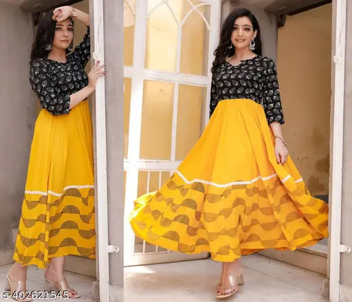 Yellow printed rayon flared kurti with three-quarter sleeves, featuring vibrant Indian print design. Suitable for S, L (40in bust), XL, XXL (44in bust)