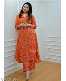 Orange cord set: Reyon printed cotton kurta with pants in vibrant ikat pattern, ideal for formal or informal events