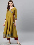 Yellow solid surplice kurtas on display, cotton blend, three-quarter sleeves, Yash Gallery women's fashion