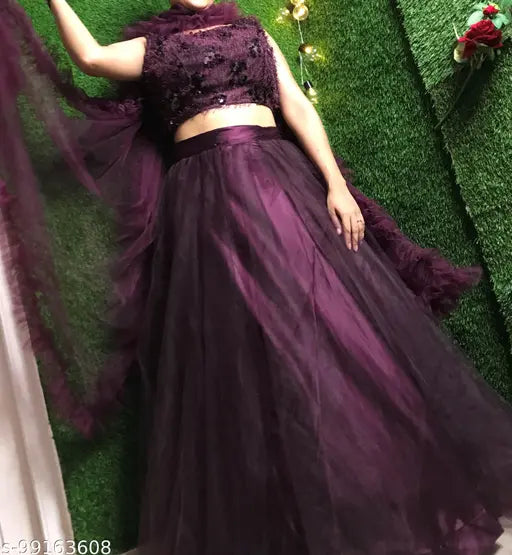 Trendy wine-colored acrylic and net lehenga choli set with matching dupatta, embellished for women's festive wear and parties