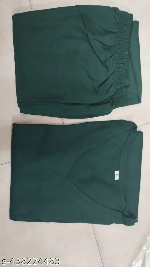 Green rayon kurta pant set with three-quarter sleeves, solid pattern from India