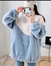 Wool colorblocked waistcoat, long sleeves. Urbane glamorous women's jacket on hanger, slight color variation