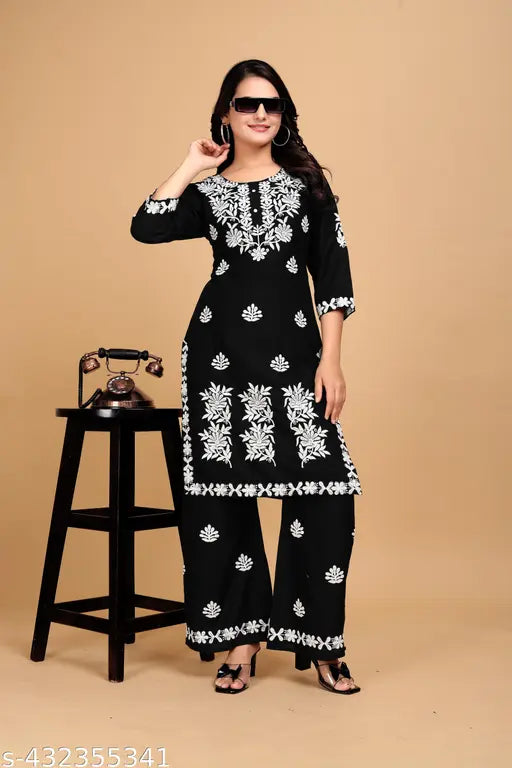 Black rayon kurta set with embroidered net pants, three-quarter sleeves. Indian traditional clothing for women, sizes M-XXXL
