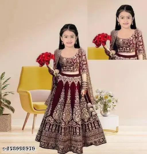 Kids ethnic wear semi-stitched embroidered velvet lehenga with short sleeves, net dupatta. Embroidered Indian kids' party outfit in velvet