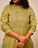 Multicolor embroidered cotton kurta and pant set for petite women, features solid print and three-quarter sleeves. Ideal for versatile styling, accentuate with accessories like dangler earrings, kundan belt, and cork heels. Comfortable cotton blend fabric. Indian origin