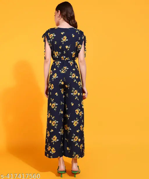 Navy blue & yellow floral printed jumpsuit (Polyester), v-neckline, flared hem, adjustable shoulder strings, waist elastic with tie-up detail, perfect for casual or special occasions, made in India