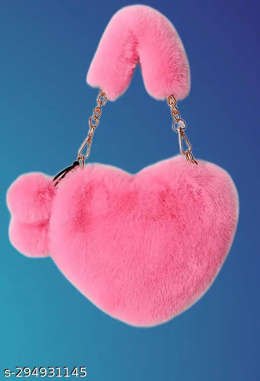 Synthetic heart-shaped sling bag with pompoms, soft faux fur, and detachable chain strap. Ideal for girls, suitable for various occasions. Indian import