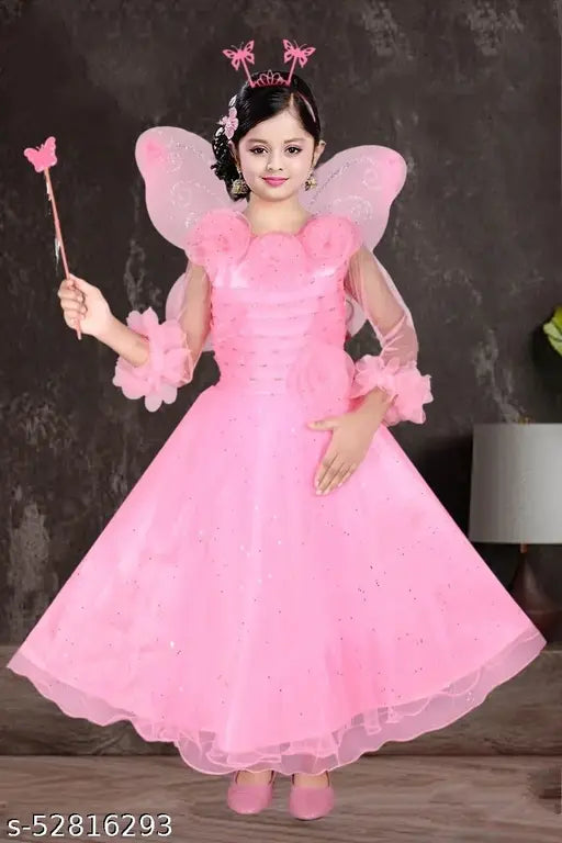 Pink net ethnic gowns pack of 10 for girls, solid net, three-quarter sleeves, various sizes from 3-6 months to 9-10 years. Indian handcrafted traditional outfits for babies and kids on display