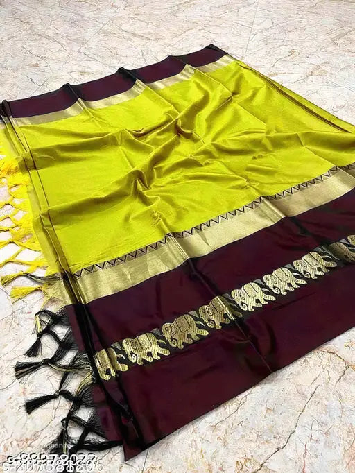 Lemon and brown brocade cotton silk saree with elephant design, traditional Indian bridal wear accessory on mannequin