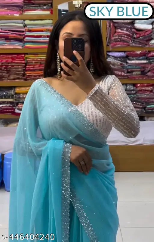 Georgette saree with all-over heavy beads, white sequin blouse - stunning Indian party wear on mannequin