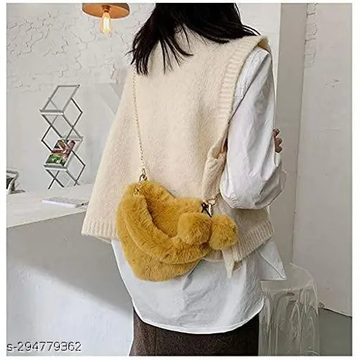 Plush PU heart-shaped crossbody bag with chain, perfect for women, featuring pom poms - India origin