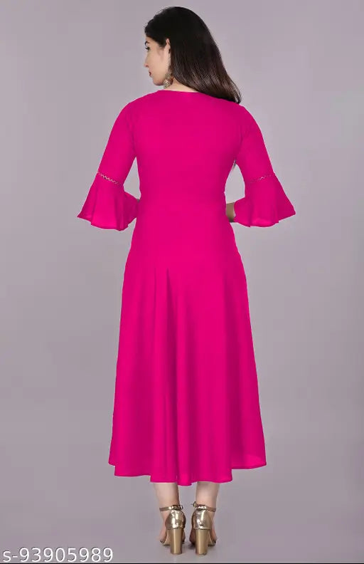 Trendy ethnic women's solid flared kurti in pink, rayon fabric with three-quarter sleeves, hand washable and machine washable, suitable for casual and formal occasions. Single size package available