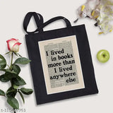 Black canvas tote bag with 'I Lived In Books' print, great for everyday carry