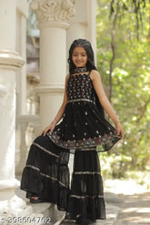 Black embroidered Georgette sharara set with matching dupatta, suitable for special occasions. 3-4 years: top length 20 inches; 4-5 years: top length 20 inches; 5-6 years: top length 22 inches; and so on up to 14-15 years. Handcrafted in India