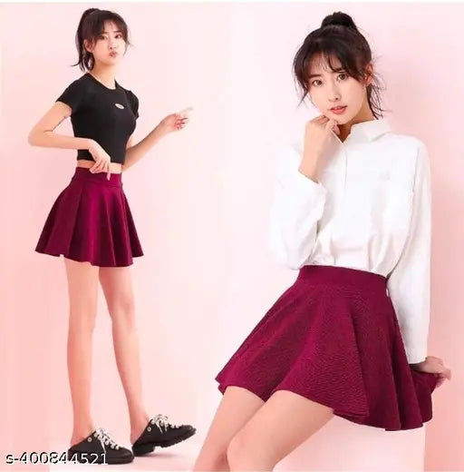 Polyester skater knee-length skirts with attached inner shorts, solid color, double layer for comfortable sports wear. Available sizes: 26, 28, 30, 32, 34, 36 (in). Made in India