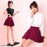 Polyester skater knee-length skirts with attached inner shorts, solid color, double layer for comfortable sports wear. Available sizes: 26, 28, 30, 32, 34, 36 (in). Made in India