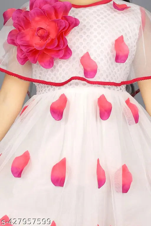 Printed net frock dress for kids ages 12 months to 10 years, featuring short sleeves and vibrant floral patterns. Indian origin