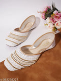 Synthetic bellies juttis in vibrant colors, stylish and comfortable for women footwear. Premium quality, perfect for casual or party wear. Easy care instructions - clean with a dry cloth