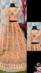 Embroidered semi-stitched net lehenga, choli and dupatta for weddings and festivals. High-quality Indian fabric with free size options. Perfect for casual or traditional events