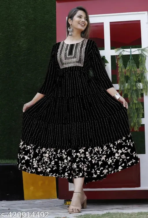 Orange rayon Anarkali kurti with embroidery, intricately detailed, three-quarter sleeve, vibrant floral print