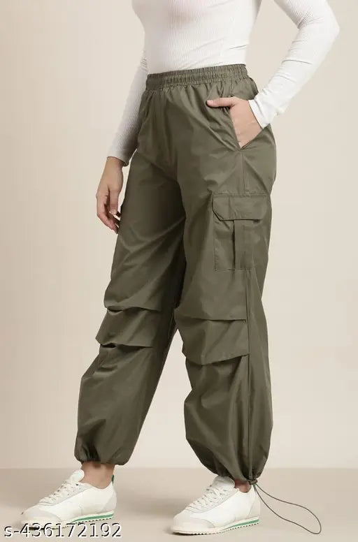 Olive green women's/girls loose cargo trousers, high-waisted design with side pockets, comfortable polyester fabric