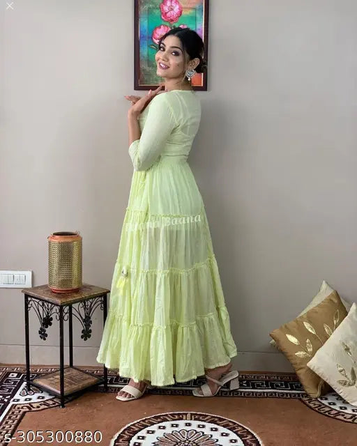 Green cotton anarkali gown with embroidered pattern, three-quarter sleeves for women. Made in India