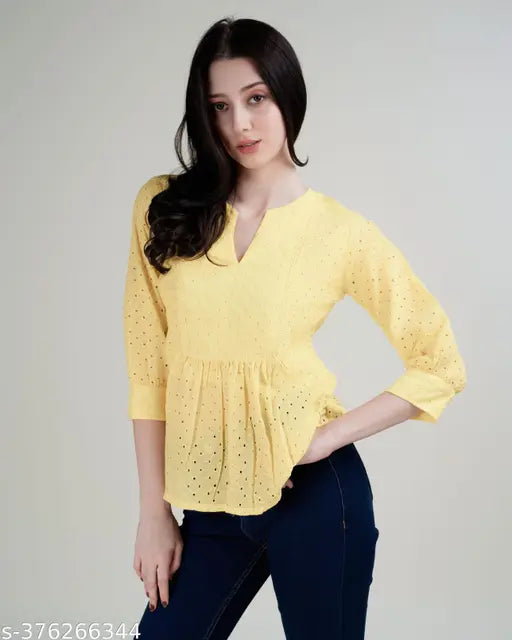 Yellow pure cotton Schiffli top with three-quarter sleeves, intricate embroidery, perfect for women's casual-chic outfits. Made in India