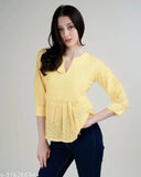 Yellow pure cotton Schiffli top with three-quarter sleeves, intricate embroidery, perfect for women's casual-chic outfits. Made in India