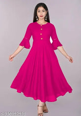 Pink rayon flared kurta for women, solid style with three-quarter sleeves. Versatile and comfortable, ideal for casual events