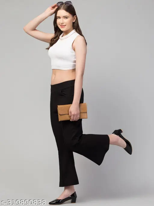 Black cotton blend bell-bottom pants for women, solid black design, easy and comfortable style from India