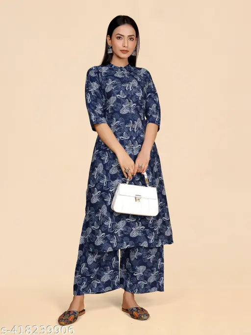 Stylish designer viscose printed kurta set with palazzos, three-quarter sleeves, cotton embroidery on Indian-origin display