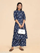 Stylish designer viscose printed kurta set with palazzos, three-quarter sleeves, cotton embroidery on Indian-origin display