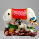 Marble-look Kamdhenu cow and Krishna idol, divine home decor for spiritual Diwali or puja. Indian poly resin statue, 4cm x 8cm x 10cm