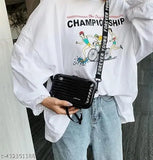 Solid PVC Forever Young sling bag for women and girls. Crossbody & mini suitcase box, multi pattern with detachable strap, waterproof case, and RFID protection. Indian-origin fashion accessory