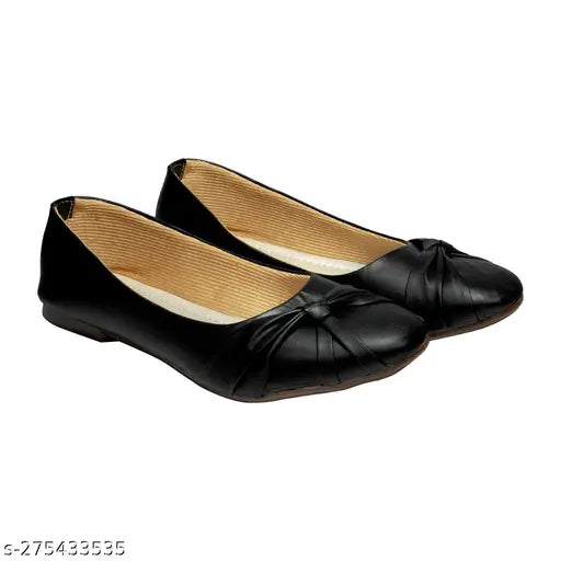 Black point synthetic leather brogues, solid design on display stand, available in sizes IND-3 to IND-8 (made in India)